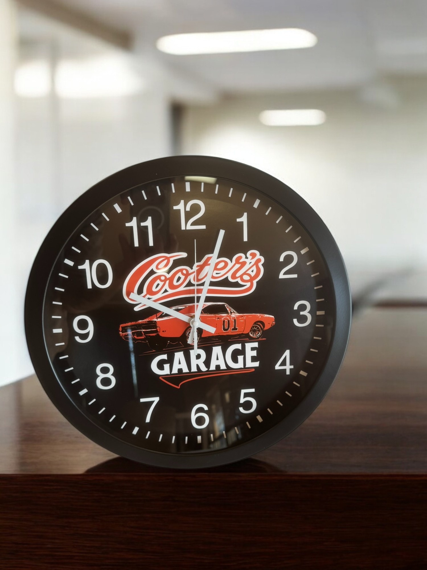 Cooter's Garage wall clock — desk view