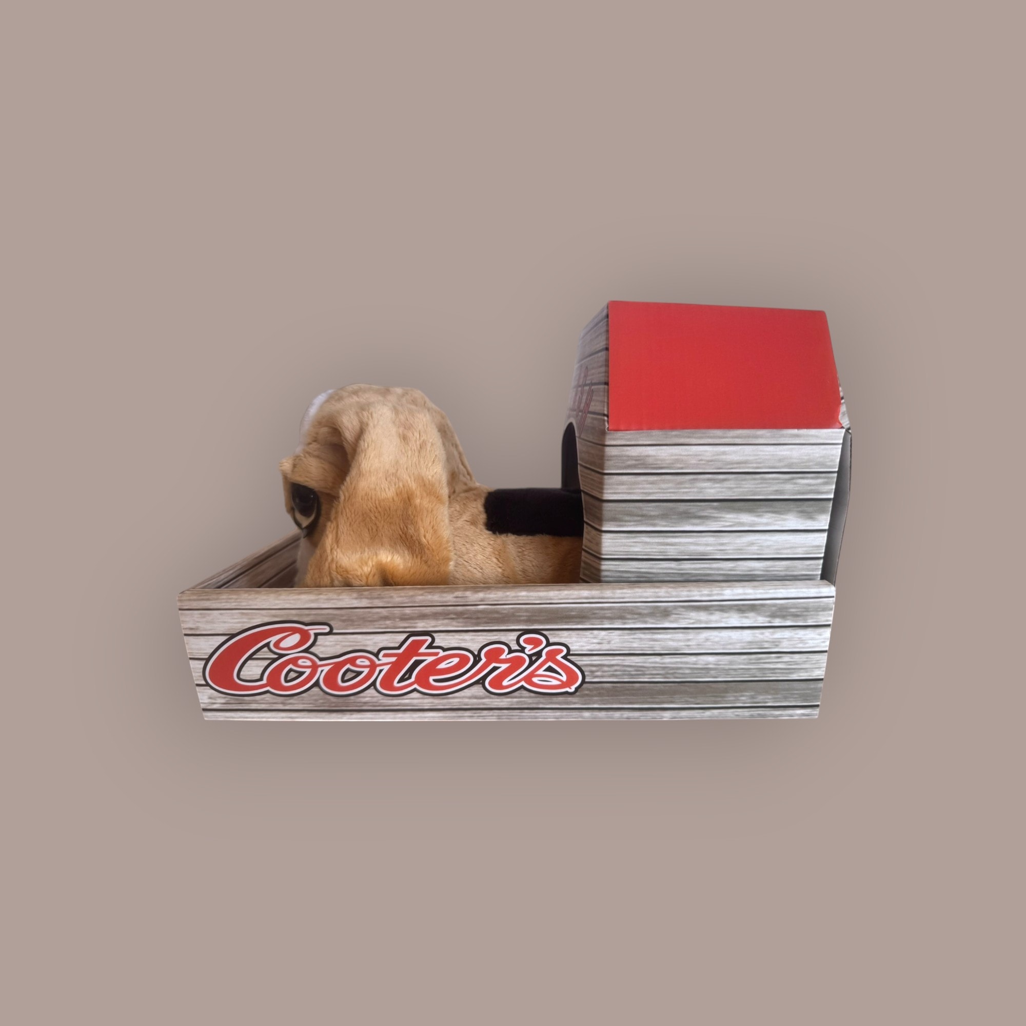 Flash the Bassett Hound plush toy — left side view in Cooter's branded crate