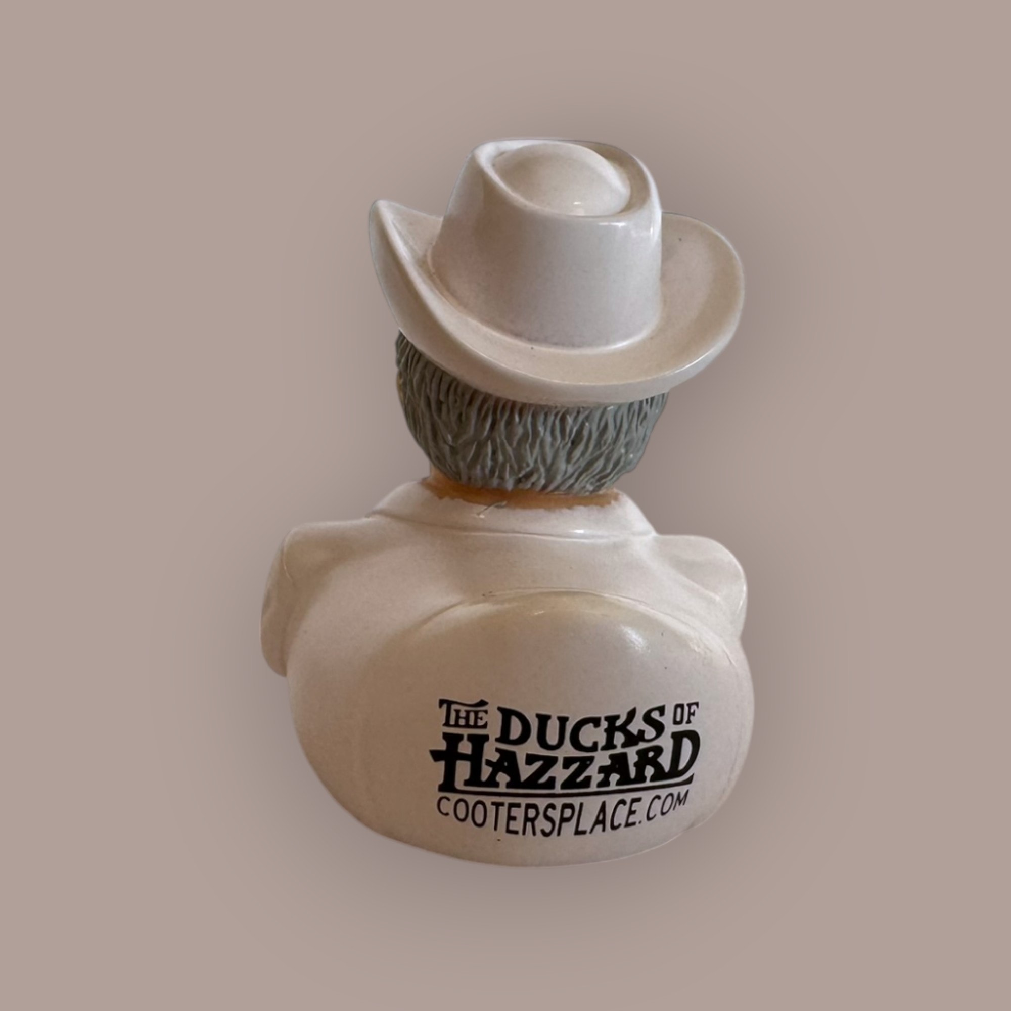 Boss Hogg duck figurine — white suit, cowboy hat