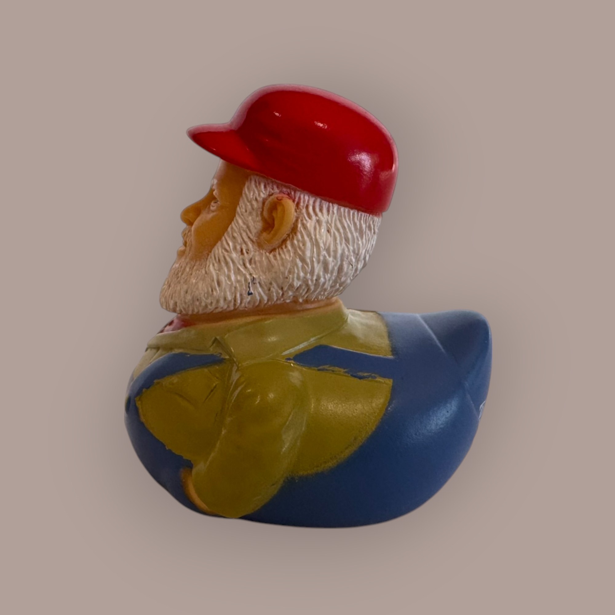 Cooter duck figurine — front view, red cap, white beard