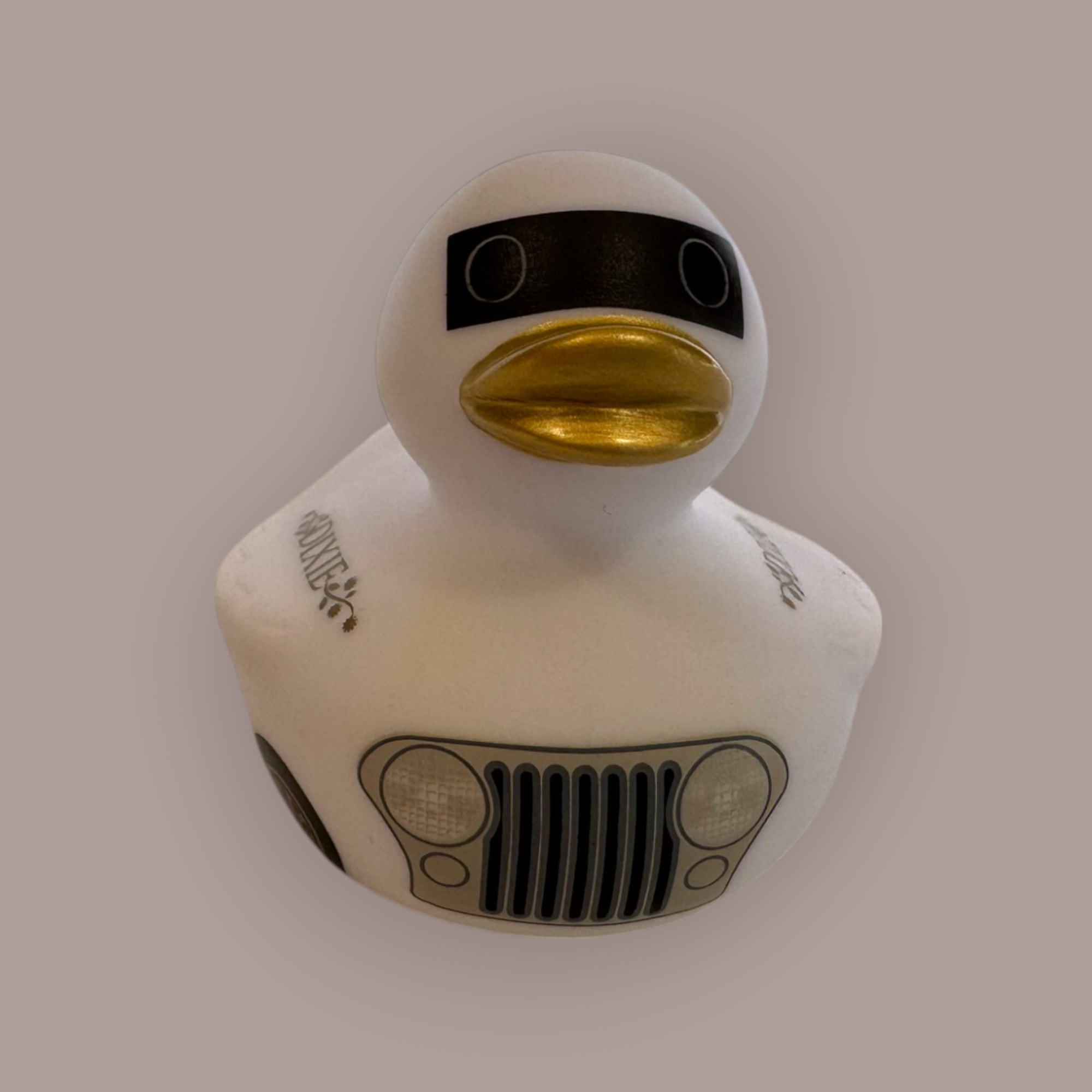 Dixie duck — front view, white body, gold beak, Jeep grill graphic