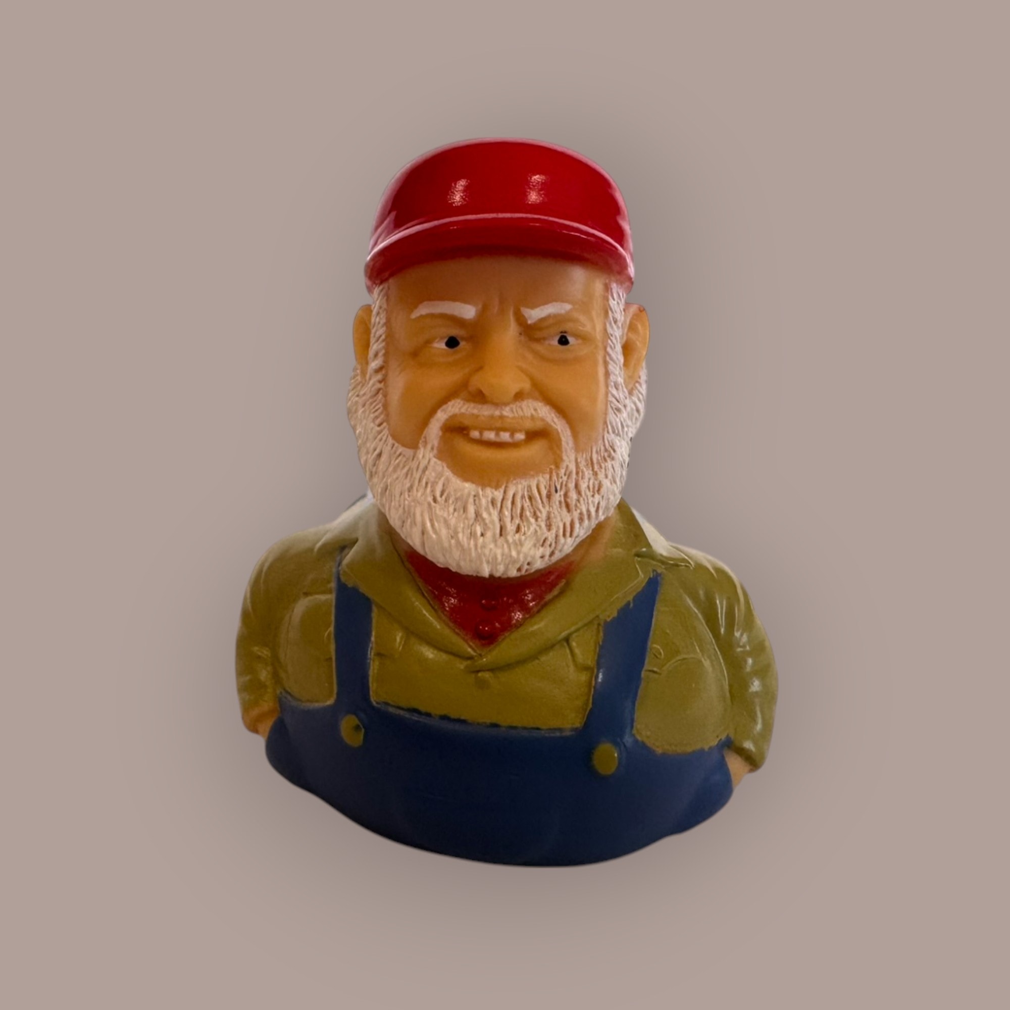 Uncle Jesse duck figurine — red cap, white beard, overalls